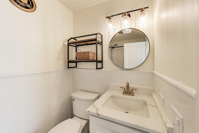 940 W Glenlake Ave Unit 19C, Chicago, IL 60660 - half bath featuring vanity, a wainscoted wall, and tile walls