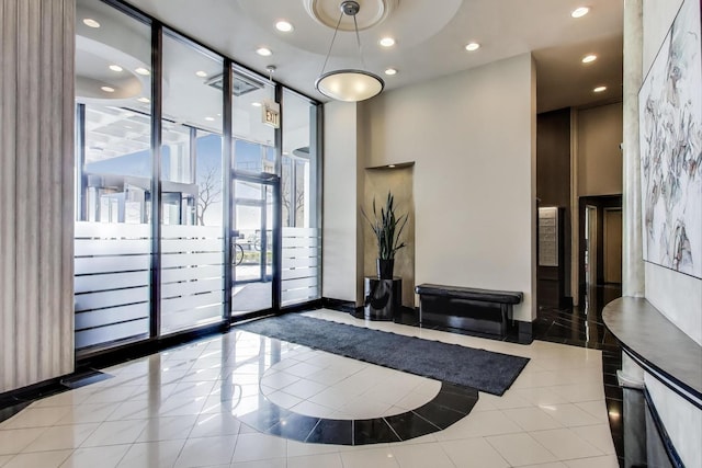 940 W Glenlake Ave Unit 19C, Chicago, IL 60660 - common area with recessed lighting, expansive windows, and a high ceiling
