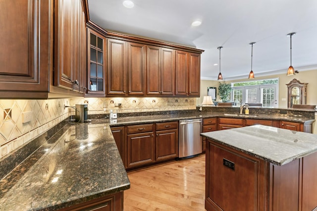 9 Aztec Ct, South Barrington, IL 60010 - kitchen with stainless steel dishwasher, a peninsula, ornamental molding, decorative backsplash, and pendant lighting
