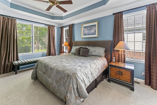 9 Aztec Ct, South Barrington, IL 60010 - carpeted bedroom with crown molding, a tray ceiling, and a ceiling fan