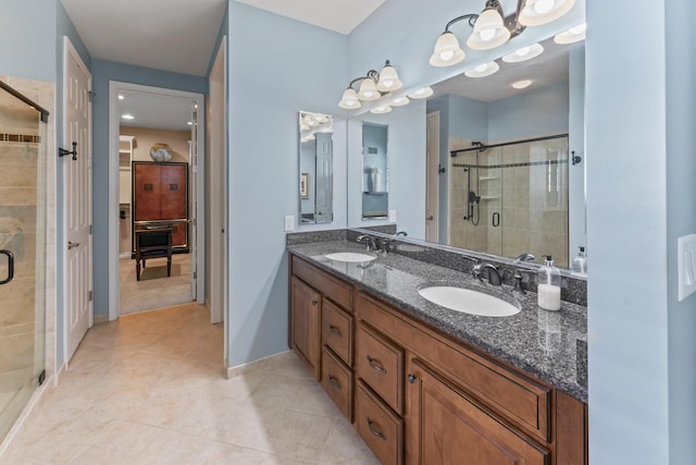 9 Aztec Ct, South Barrington, IL 60010 - bathroom featuring a shower stall, tile patterned floors, double vanity, and a closet