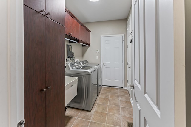 9 Aztec Ct, South Barrington, IL 60010 - washroom with washing machine and dryer, cabinet space, and light tile patterned floors