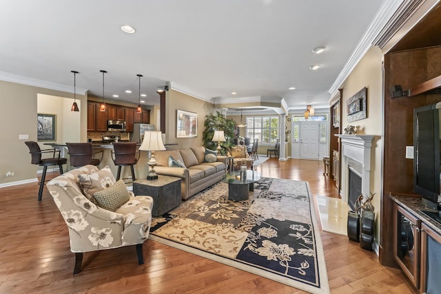 9 Aztec Ct, South Barrington, IL 60010 - living room with light wood-type flooring, recessed lighting, ornamental molding, and a fireplace
