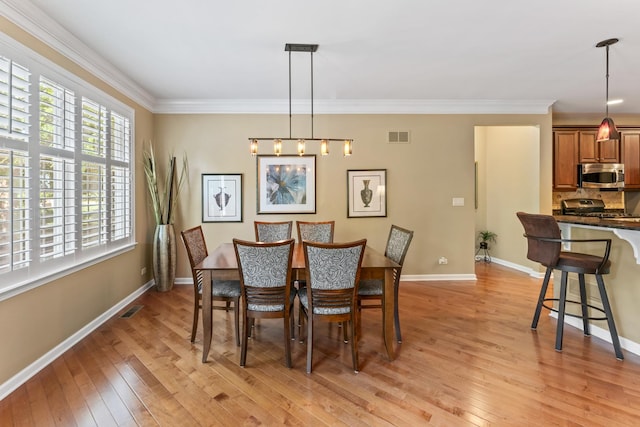 9 Aztec Ct, South Barrington, IL 60010 - dining space featuring light wood finished floors and crown molding