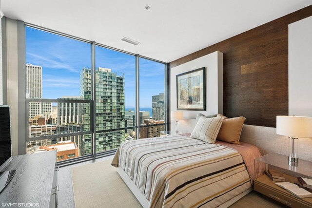 240 E Illinois St Unit 2702, Chicago, IL 60611 - bedroom with a view of city, multiple windows, and expansive windows