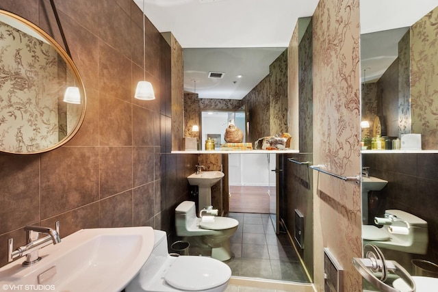 240 E Illinois St Unit 2702, Chicago, IL 60611 - bathroom featuring tile walls, tile patterned flooring, and wallpapered walls