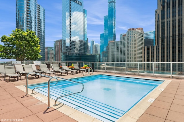 240 E Illinois St Unit 2702, Chicago, IL 60611 - community pool with a skyline view and a patio area