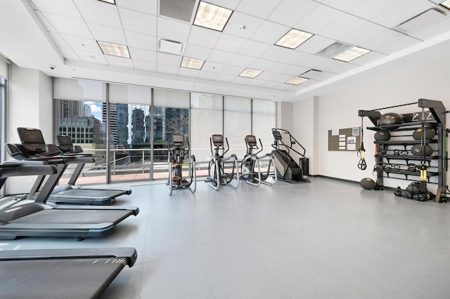 240 E Illinois St Unit 2702, Chicago, IL 60611 - workout area with a paneled ceiling, expansive windows, and a raised ceiling