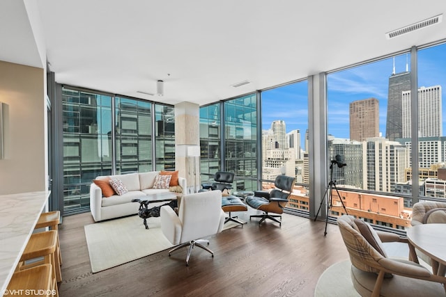 240 E Illinois St Unit 2702, Chicago, IL 60611 - living room with floor to ceiling windows, wood finished floors, and a skyline view