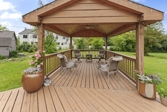 216 Hickory Ct, Northbrook, IL 60062 - wooden terrace featuring a ceiling fan, a storage unit, a yard, and a gazebo