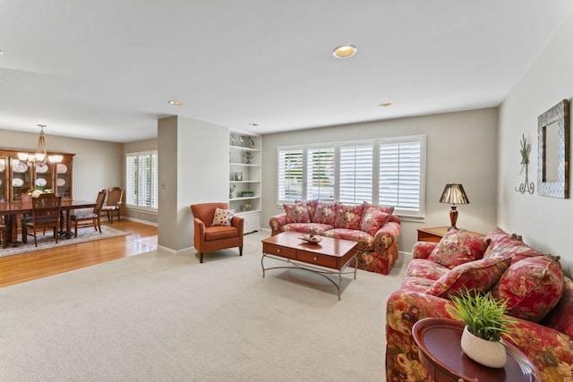 216 Hickory Ct, Northbrook, IL 60062 - carpeted living room with a chandelier and recessed lighting