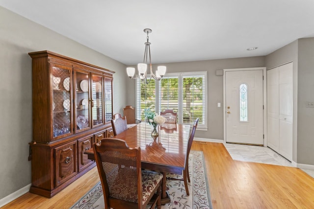 216 Hickory Ct, Northbrook, IL 60062 - dining area featuring a chandelier and light wood-style flooring