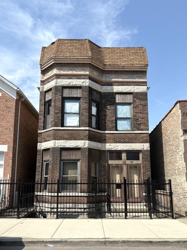2838 S Keeley St, Chicago, IL 60608 - view of front of home featuring brick siding and a fenced front yard