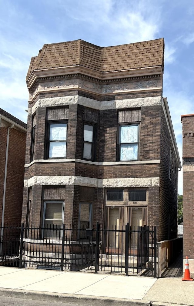 2838 S Keeley St, Chicago, IL 60608 - view of building exterior featuring a fenced front yard