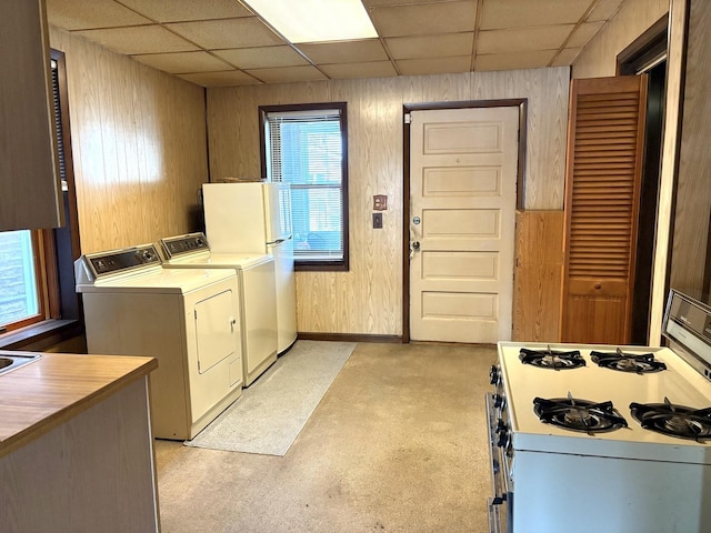2838 S Keeley St, Chicago, IL 60608 - washroom featuring washer and clothes dryer and wooden walls