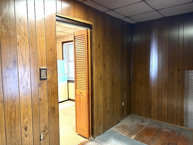 2838 S Keeley St, Chicago, IL 60608 - spare room featuring wood walls, a paneled ceiling, and a heating unit