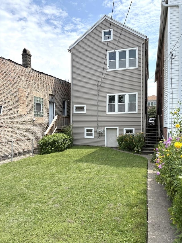 2838 S Keeley St, Chicago, IL 60608 - rear view of house with stairway and a yard