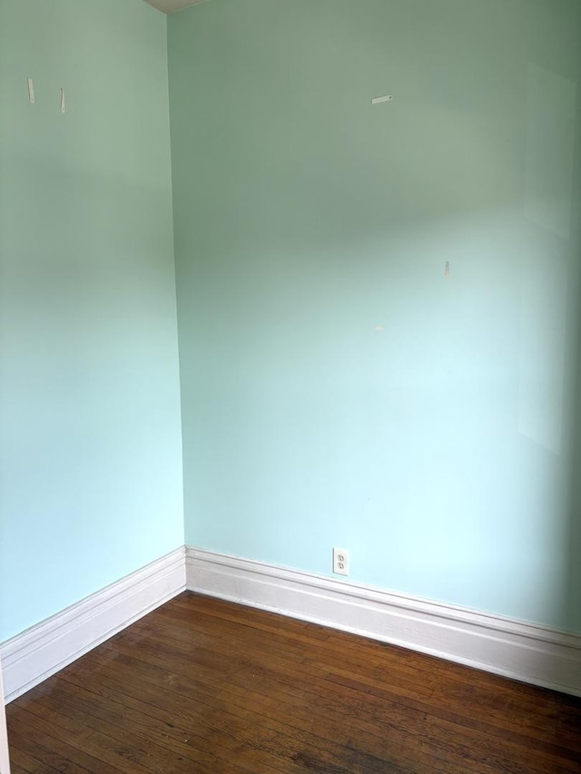 2838 S Keeley St, Chicago, IL 60608 - unfurnished room with baseboards and dark wood finished floors