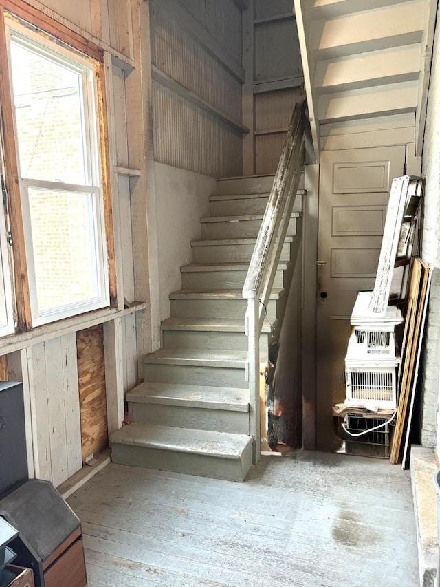 2838 S Keeley St, Chicago, IL 60608 - staircase featuring plenty of natural light and wood walls