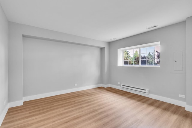 24642 George Washington Dr, Plainfield, IL 60544 - spare room with baseboard heating and light wood-type flooring