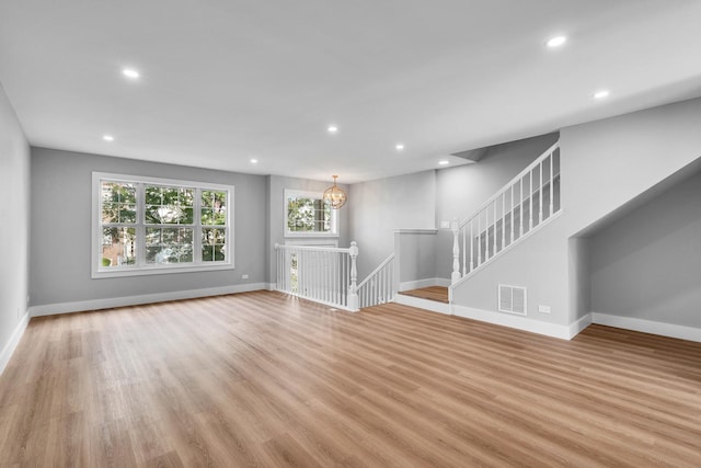 24642 George Washington Dr, Plainfield, IL 60544 - unfurnished living room featuring recessed lighting and wood finished floors