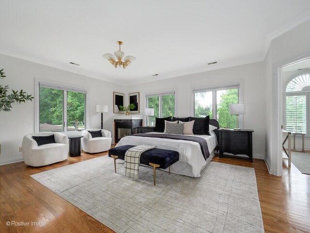 2612 Wilmette Ave, Wilmette, IL 60091 - bedroom featuring ornamental molding, wood finished floors, and a chandelier