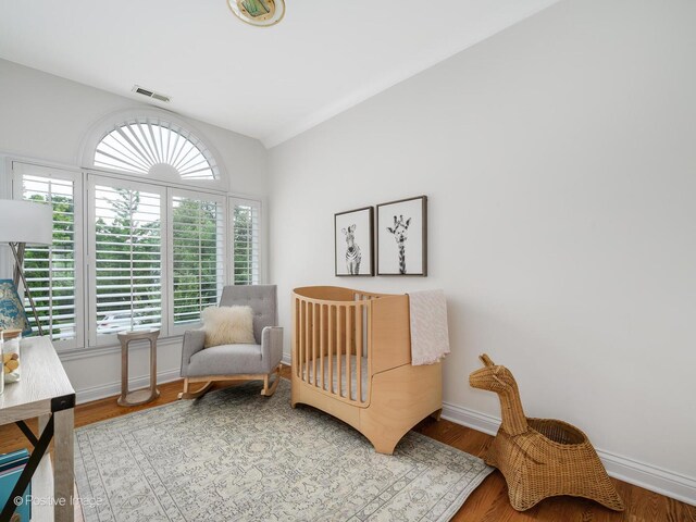 2612 Wilmette Ave, Wilmette, IL 60091 - bedroom with vaulted ceiling and wood finished floors