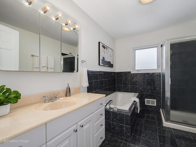 2612 Wilmette Ave, Wilmette, IL 60091 - bathroom with vanity, a garden tub, and a shower stall