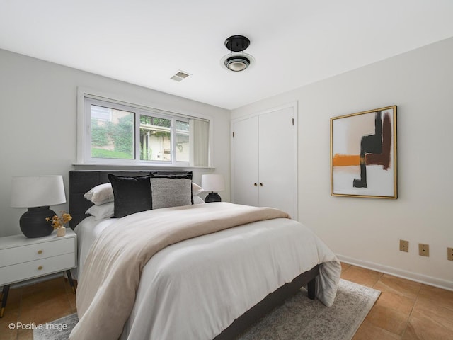 2612 Wilmette Ave, Wilmette, IL 60091 - bedroom featuring light tile patterned flooring and a closet
