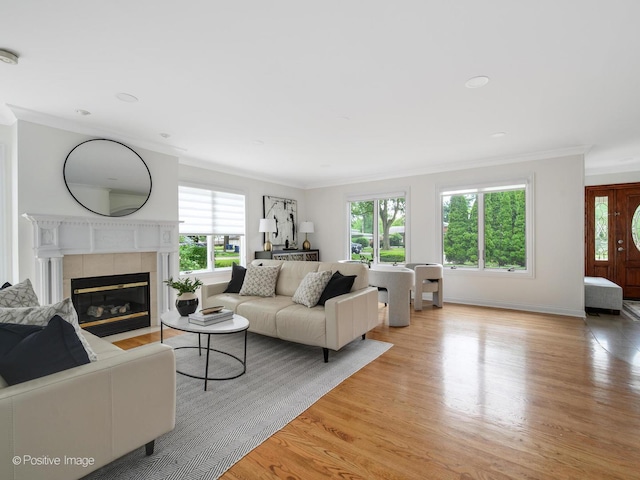 2612 Wilmette Ave, Wilmette, IL 60091 - living room with ornamental molding, light wood-style flooring, a tile fireplace, and recessed lighting