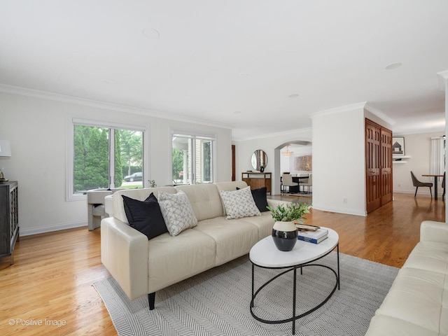 2612 Wilmette Ave, Wilmette, IL 60091 - living room with ornamental molding, arched walkways, and light wood-style flooring