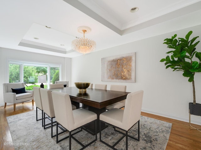 2612 Wilmette Ave, Wilmette, IL 60091 - dining area featuring a raised ceiling, light wood-style flooring, crown molding, a chandelier, and recessed lighting