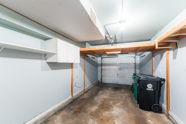327 Georgetown Ct Unit B, Bloomingdale, IL 60108 - garage featuring baseboards