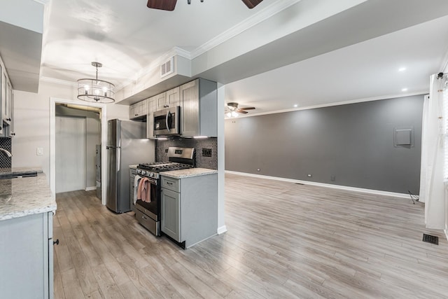 327 Georgetown Ct Unit B, Bloomingdale, IL 60108 - kitchen featuring a ceiling fan, stainless steel appliances, gray cabinetry, ornamental molding, and light wood-style floors
