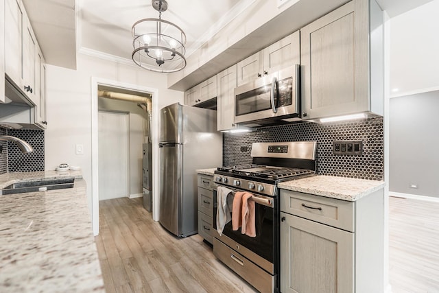 327 Georgetown Ct Unit B, Bloomingdale, IL 60108 - kitchen with stainless steel appliances, crown molding, light wood-style flooring, backsplash, and light stone countertops
