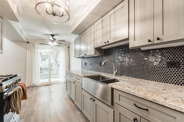 327 Georgetown Ct Unit B, Bloomingdale, IL 60108 - kitchen with stainless steel gas range oven, backsplash, crown molding, light wood-style floors, and ceiling fan