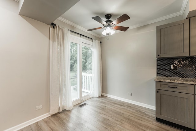 327 Georgetown Ct Unit B, Bloomingdale, IL 60108 - unfurnished dining area with light wood finished floors, a ceiling fan, and crown molding