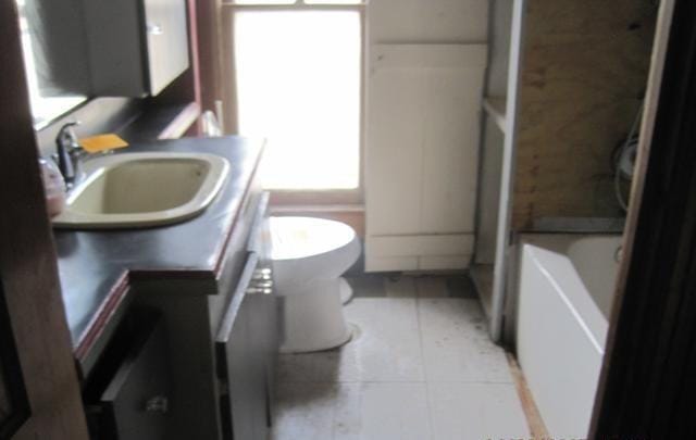 900 Willard St, Galesburg, IL 61401 - bathroom with a bath and tile patterned floors