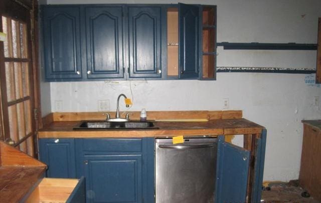 900 Willard St, Galesburg, IL 61401 - kitchen with blue cabinets, dishwasher, open shelves, and tasteful backsplash
