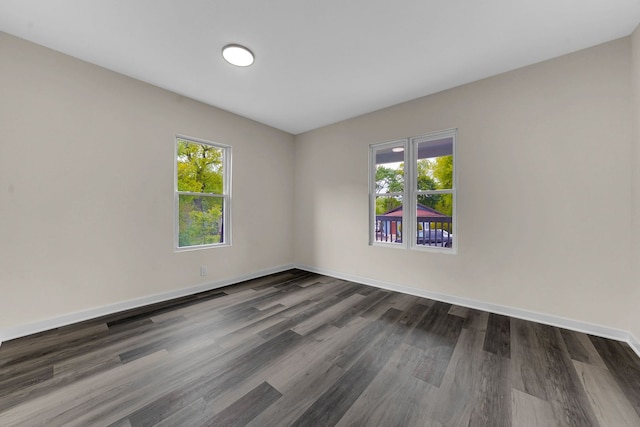 515 George Ave, Waukegan, IL 60085 - spare room with dark wood-style floors and baseboards