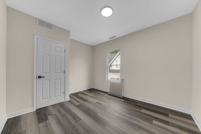 515 George Ave, Waukegan, IL 60085 - empty room featuring dark wood-style flooring and baseboards
