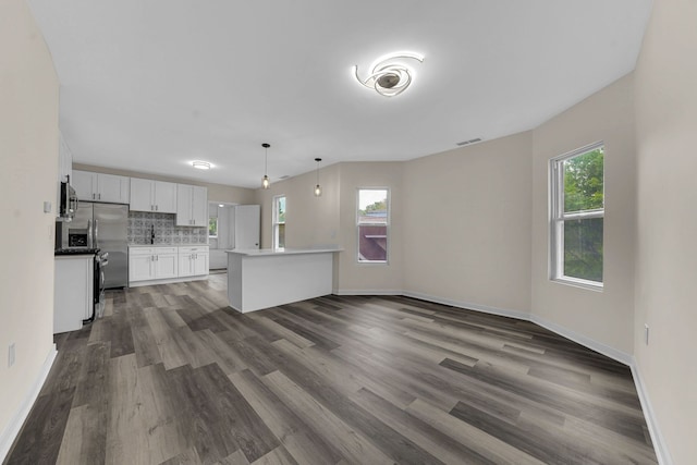 515 George Ave, Waukegan, IL 60085 - unfurnished living room with dark wood-style floors and baseboards