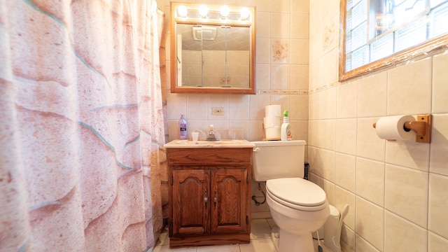 10747 S S Ave H, Chicago, IL 60617 - full bath featuring vanity, tile walls, tile patterned flooring, and a shower with shower curtain