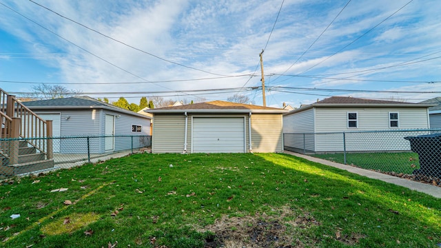 10747 S S Ave H, Chicago, IL 60617 - fenced backyard featuring a detached garage and an outdoor structure