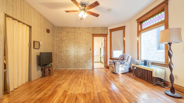 10747 S S Ave H, Chicago, IL 60617 - sitting room with light wood-style flooring, a ceiling fan, and radiator