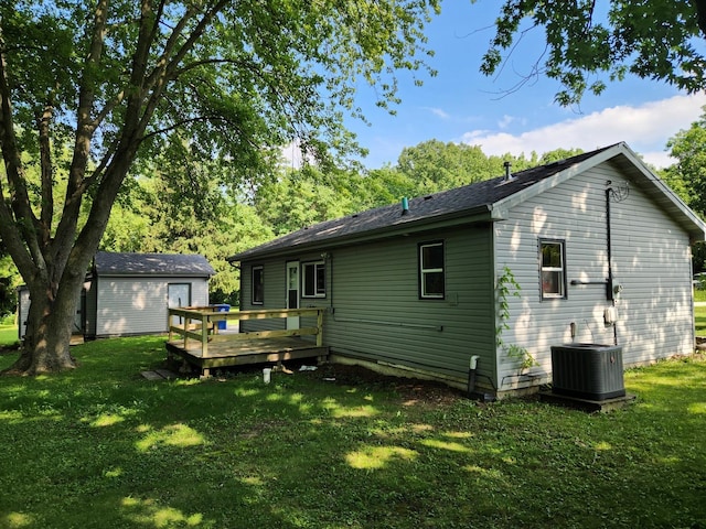 3100 W Brooke Ave, Waukegan, IL 60087 - rear view of property featuring a deck and a lawn