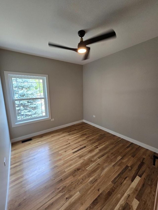 327 Lincoln Ave, Woodstock, IL 60098 - empty room featuring ceiling fan and wood finished floors