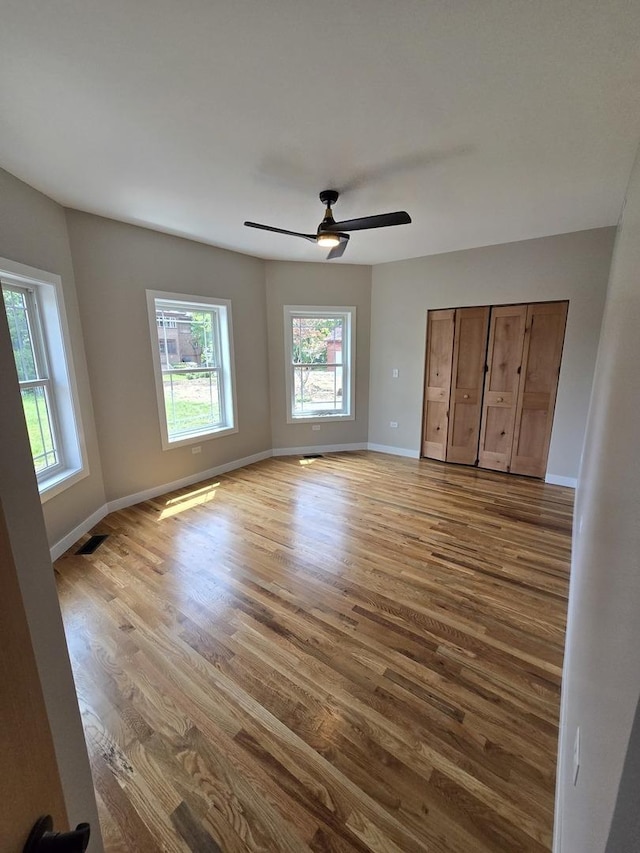327 Lincoln Ave, Woodstock, IL 60098 - unfurnished bedroom with wood finished floors and a ceiling fan