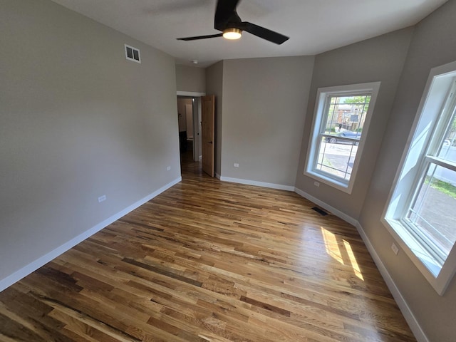 327 Lincoln Ave, Woodstock, IL 60098 - spare room featuring wood finished floors and ceiling fan