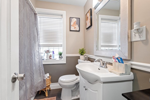 6921 26th St, Berwyn, IL 60402 - bathroom featuring vanity, curtained shower, and wood finished floors